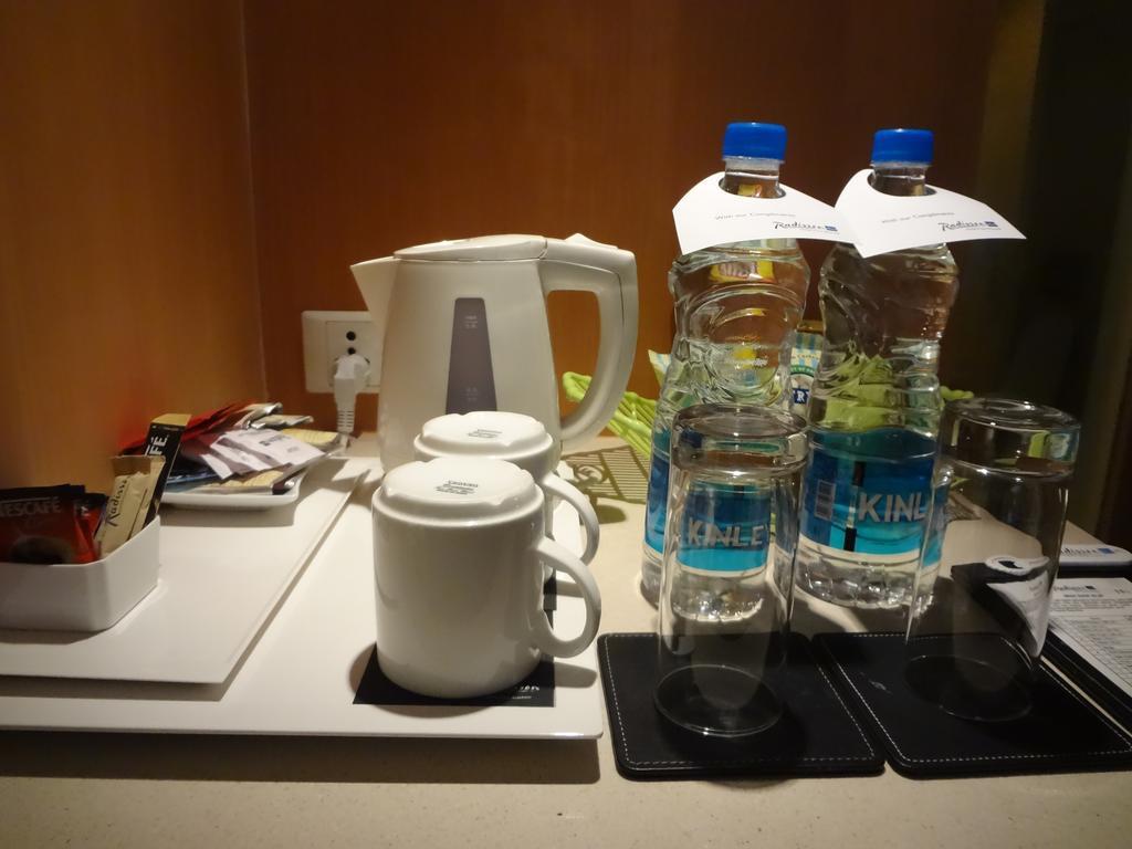 Radisson Blu Hotel Pune Kharadi Exterior photo Bottled water in a hotel room
