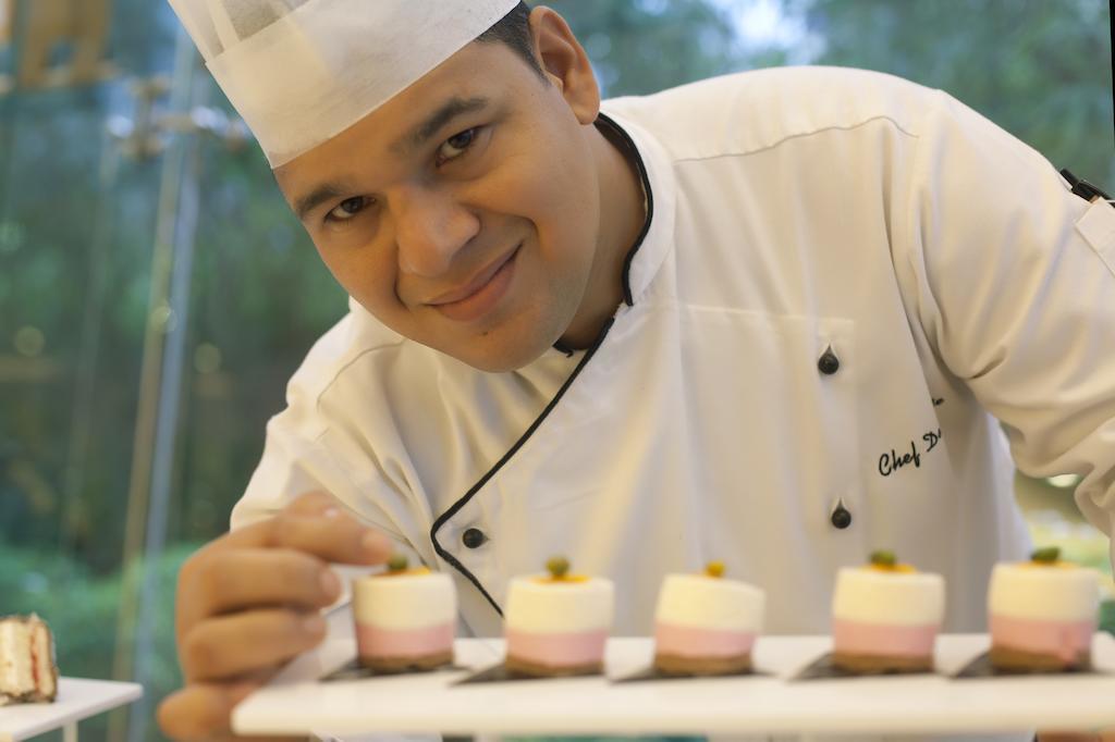 Radisson Blu Hotel Pune Kharadi Exterior photo Chef preparing dessert